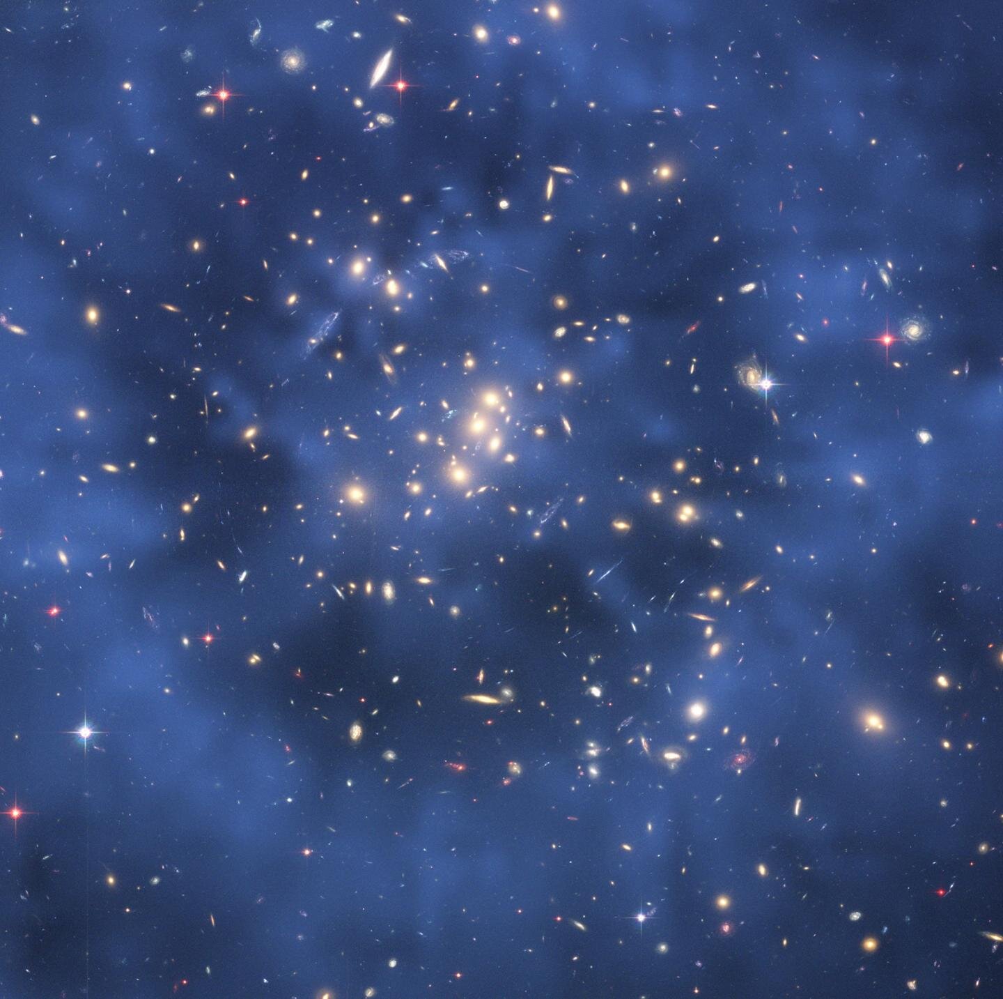 Hubble Space Telescope composite image shows a ghostly ring of dark matter in a galaxy cluster.jpg